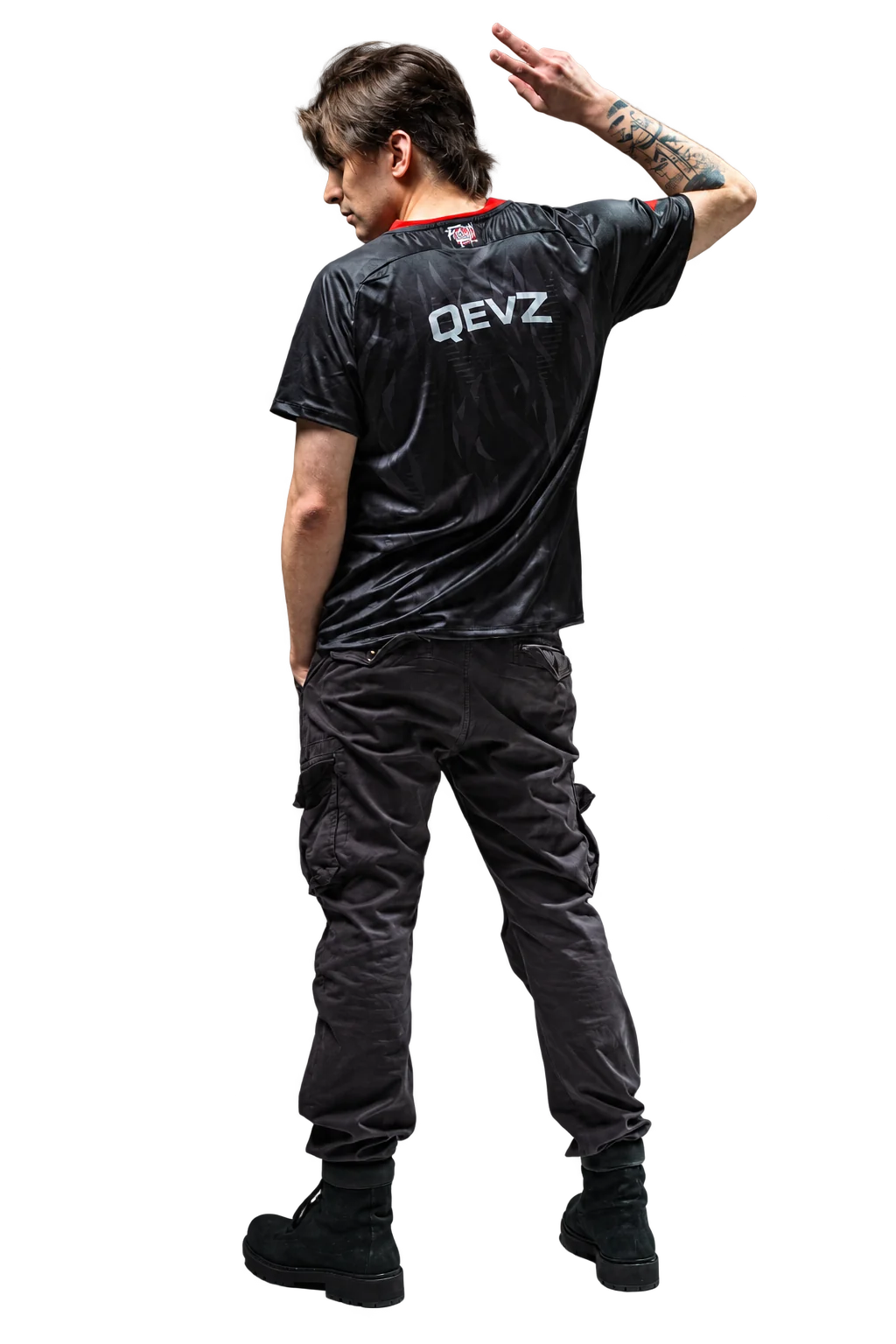 Kevin Daniel Houlli wearing a QEVZ jersey